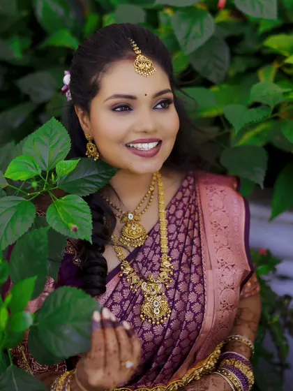 A radiant bride-to-be smiles, captured in a candid moment during her engagement celebration.
