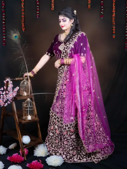 This purple velvet lehenga is perfect for creating elegant and timeless portraits for any occasion.