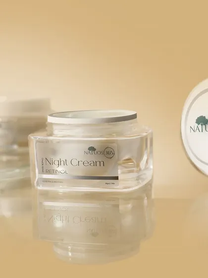 A shot of Natuos 365 Night Cream jars with reflections on a glossy surface. Reflections can add a sense of polish and high-end quality to product photos.