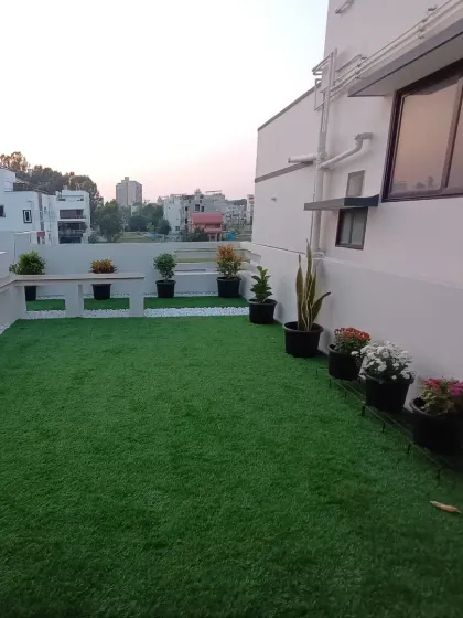 The finished rooftop space at dusk. The artificial grass stays perfectly green, providing a beautiful view at any time of day.