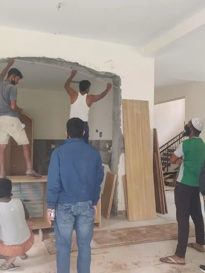 The process of creating an arch requires precision and a deep understanding of materials. Here, my team is in the middle of constructing the framework for a new archway. This behind-the-scenes shot shows the civil work involved in reshaping a home's layout before the finishing touches are applied.