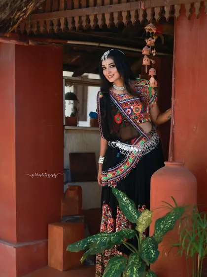 A vibrant and energetic series celebrating Navratri. The model is dressed in colorful Garba attire, and the photos capture the festive spirit through dynamic poses and joyful expressions.