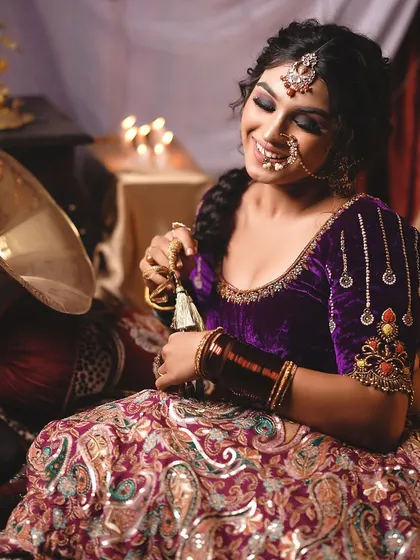 A soft, smiling pose that contrasts with the dramatic theme, showing the model's versatility.