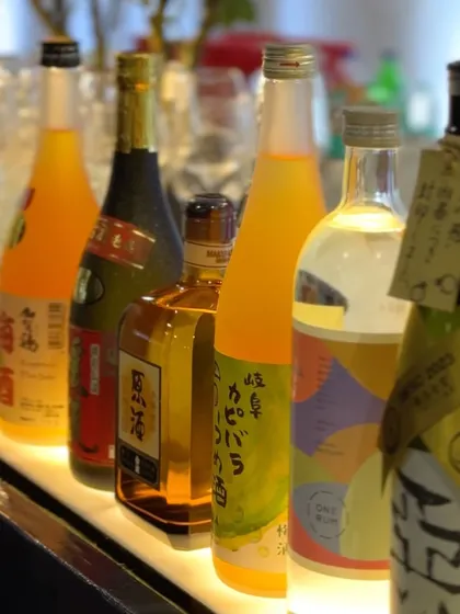 A selection of Japanese sake and other spirits at the Japan Reception during WTSA 2024. We work with clients to source and serve specific beverages to suit their event's theme and guests' preferences.