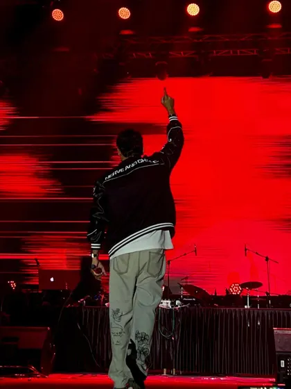 A powerful shot from behind at my IISC Bangalore show, with a massive red LED backdrop.