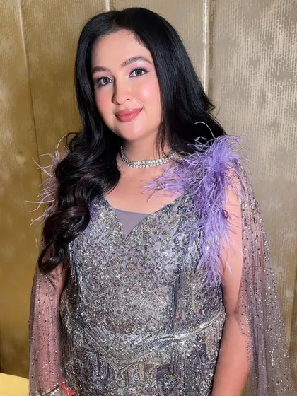 Ishita looking like a dream. The full look showcases how the soft, glowing makeup perfectly complements the dramatic and beautiful details of her cocktail gown.