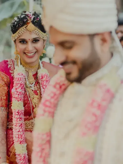 A sweet glance from the bride towards her groom during the wedding ceremony, a precious moment captured within the beautiful setting I designed.