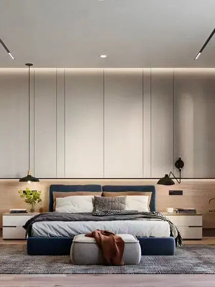 We designed this master bedroom as a tranquil retreat, with a focus on clean lines and sophisticated comfort. The floor-to-ceiling panelled wardrobe provides ample storage while the combination of ambient and task lighting creates a warm, inviting atmosphere.