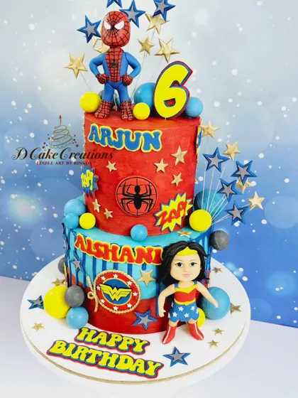 A superhero showdown on a two-tier cake for Arjun and Aishani's 6th birthday. Spiderman stands guard on top while Wonder Woman is ready for action below.