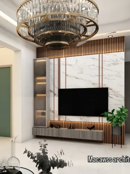 This custom TV unit combines wood fluting, a marble-effect back panel, and built-in shelving with accent lighting. It's a functional centerpiece that adds texture and sophistication to the living room.