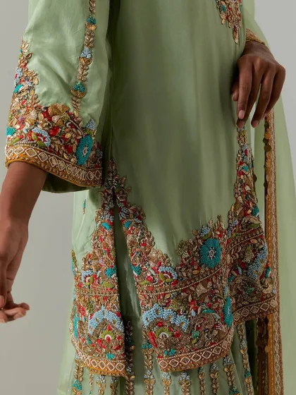 A close-up look at the soul of my collection: the craftsmanship. This shot highlights the multi-colored threadwork, sequins, and beadwork that bring our designs to life, turning fabric into art.