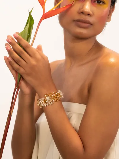 Enhance your wrist with our classic crafted bracelets, like this one featuring pearls and gold beads.