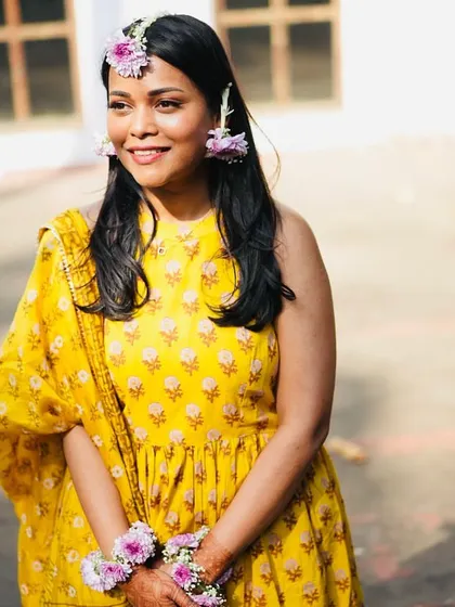 The bride looking joyful and relaxed during her haldi ceremony. My planning process is designed to handle all the stress so you can simply enjoy your day.