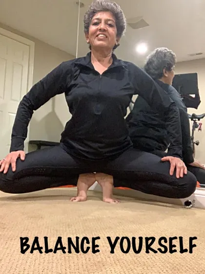 Finding your balance in a low squat. This pose challenges your stability and strengthens your ankles and feet, which is important as your center of gravity shifts.
