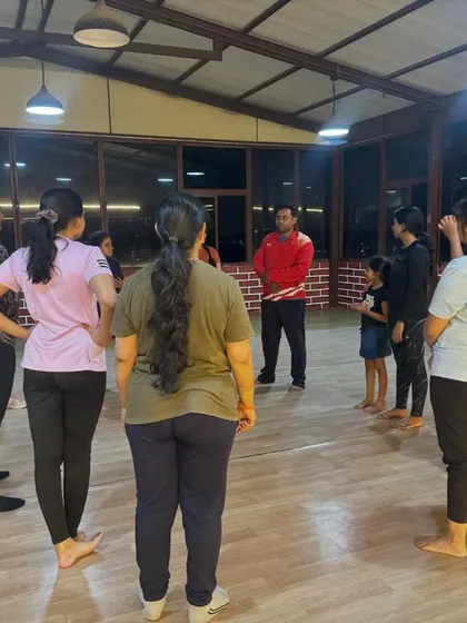 Our coach leading a discussion with the workshop group. We encourage questions and interaction to ensure everyone understands the concepts behind the physical techniques.