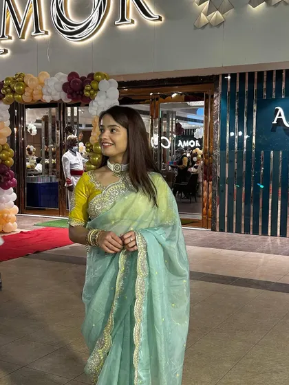 Attending an event in a beautiful organza saree.