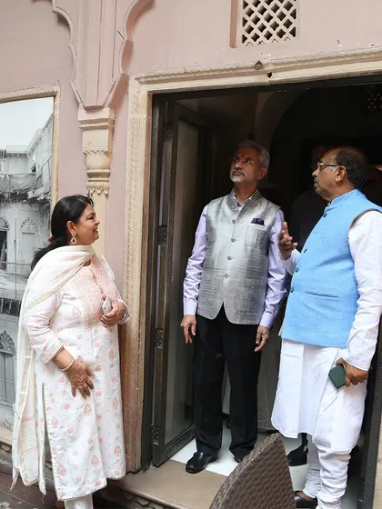 Discussing the finer details of the restoration with guests during the inauguration. The project involved reviving everything from the facade to the interior finishes with historical accuracy.