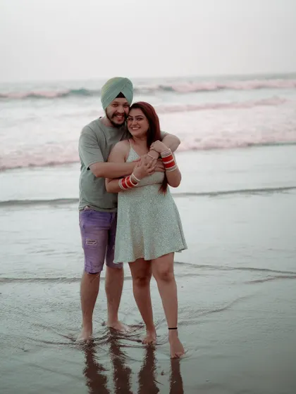 A happy embrace in the shallow waters. I love capturing these playful, carefree moments that show a couple's true personality.