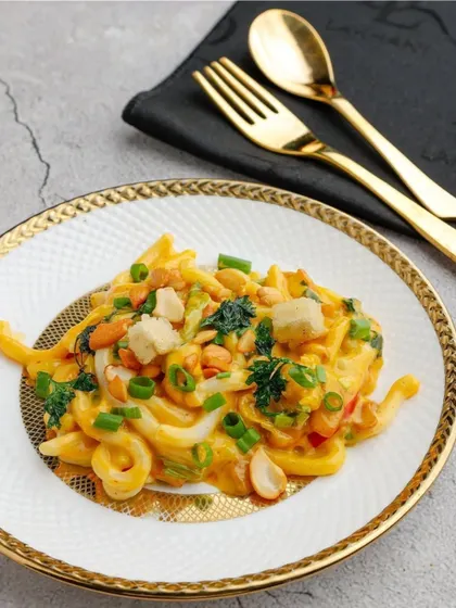 A unique fusion of Japanese and South American flavours. Our Peruvian Udon Noodles are tossed in a creamy, spicy sauce with fresh vegetables and peanuts, offering a truly global taste experience.