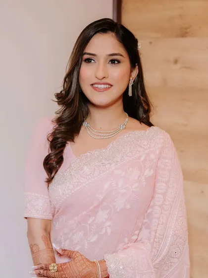 A close-up of the engagement look, showing the soft brown and pink tones on the eyes and the radiant, flawless skin.