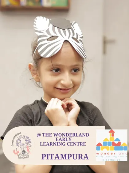 A young girl in a zebra mask, fully in character during our "Yarntellers" program at The Wonderland Early Learning Centre.