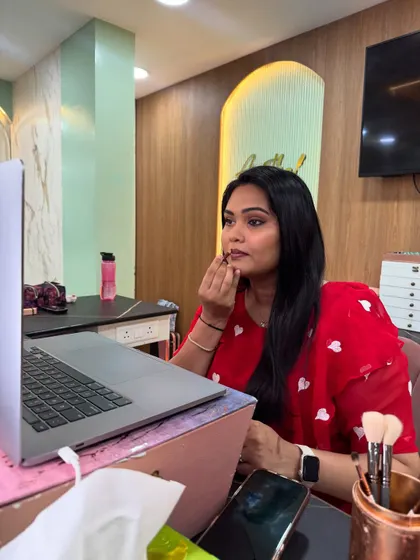 Even in an online class, I focus on the details. Here, I'm demonstrating my technique for applying lipstick perfectly, a skill that completes any makeup look.