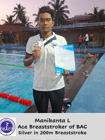 Manikanta L posing with his silver medal.