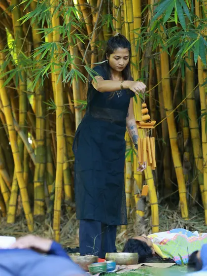 Using Koshi chimes during an outdoor Savasana. The gentle, melodic tones of the chimes are perfect for lulling the mind into a state of peace.