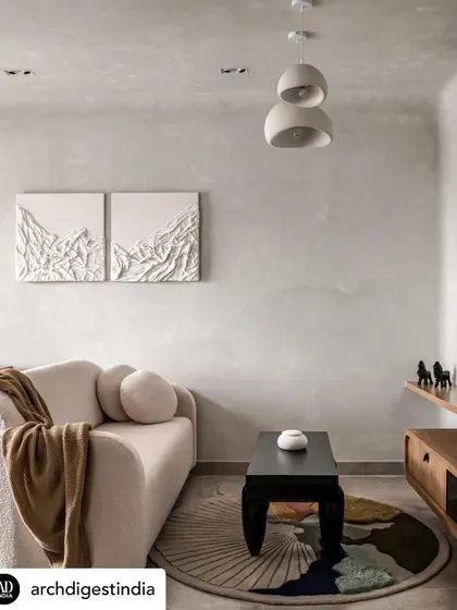 For this 450-square-foot apartment, I used the principles of wabi-sabi to create a soothing sanctuary. The living area features a curved boucle couch, textured art, and a neutral palette to create a calm backdrop, proving that even small spaces can feel expansive and peaceful.