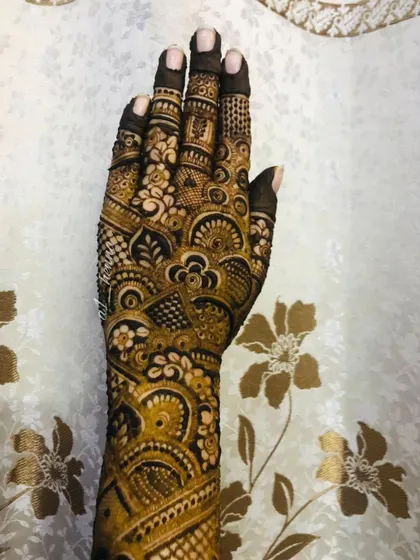 A close-up of a very intricate design on a single hand.