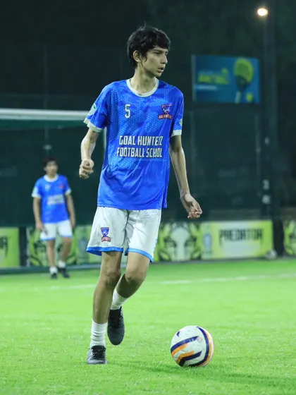 One of our young academy players focused on the ball during a training session.