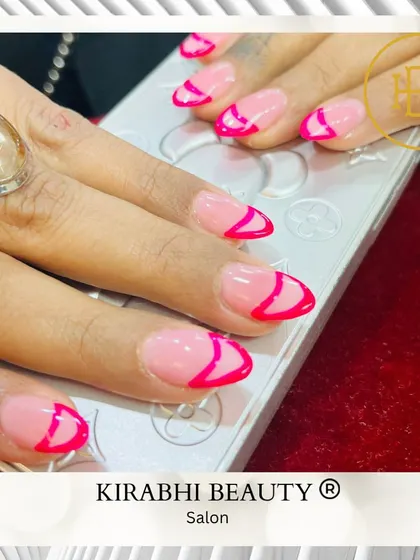 A fun, graphic take on the French manicure. I used a bright, hot pink polish to create an abstract tip design on a sheer pink base.