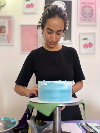 Concentrating on getting the buttercream smooth. Every cake is a canvas, and I take my time to make sure it's just right.