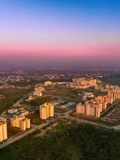 This stunning twilight aerial view of AIIMS Guwahati captures the scale and vision of the project. It embodies a transformative vision for India's public healthcare, prioritizing community well-being through innovative and scalable design.