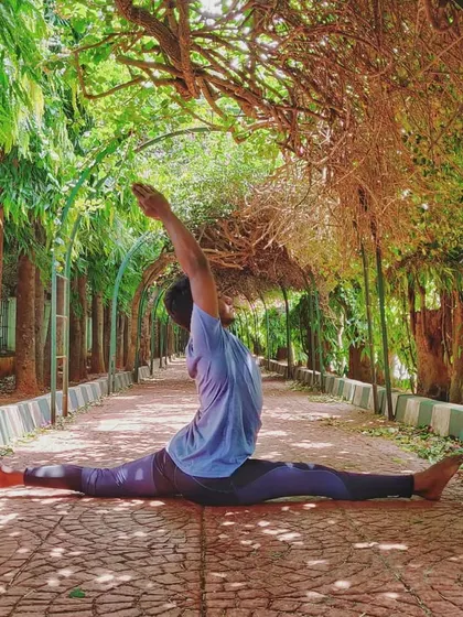Another angle of the split, this time under a beautiful green archway. The environment you practice in can deeply influence the feeling of a pose.