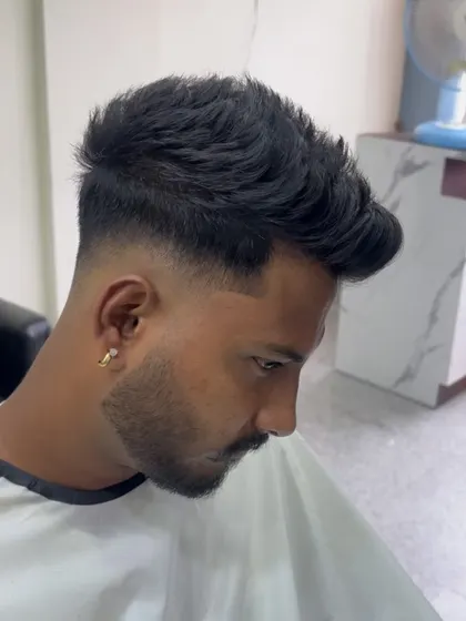 A different angle of the fade with a line design, showing how it complements the overall haircut.