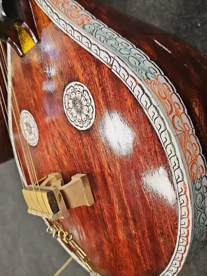 A detailed shot of the beautiful inlay work on a Saraswati veena. We offer various kinds of veenas for you to buy or even rent through our Rentkarr service.