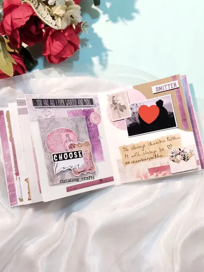 An inside page of the vintage mini scrapbook with layered photos and notes.