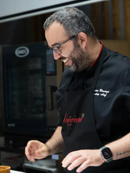 The joy of creation. A smiling Chef Karim Bourgi during his hands-on masterclass, sharing his passion for pastry with our students.