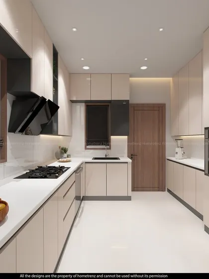 This kitchen features beige, high-gloss laminate cabinets and a white countertop, creating a bright and spacious feel. The design includes a tall unit for a built-in oven and microwave.