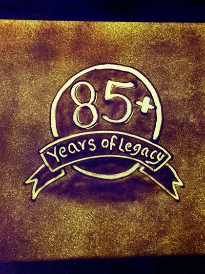 Celebrating Crompton's "85+ Years of Legacy" in sand. This piece was part of a larger narrative showcasing the company's long and successful history during their corporate event.