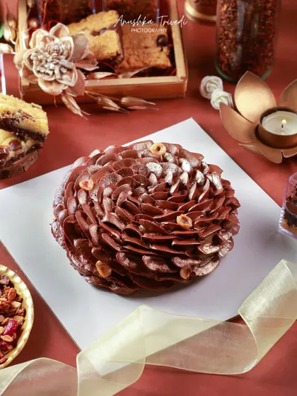An intricately designed chocolate pinecone cake, showcasing incredible pastry art and creativity.