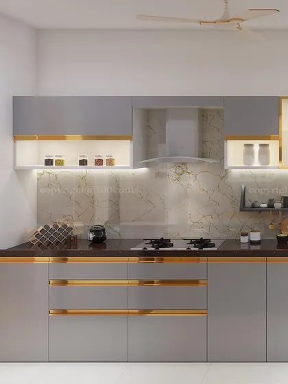 The kitchen is the soul of the home, and this one was designed to be both warm and modern. We combined sleek grey cabinetry with subtle gold accents and a marble backsplash to create a space that is as perfect for cooking daily meals as it is for entertaining guests.