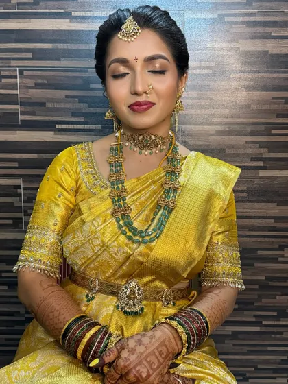 A close-up of Diksha's eye makeup. The golden shimmer on the lids catches the light beautifully, making her eyes the star of the show.