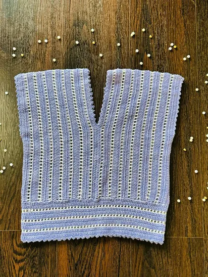 My new lavender and cream V-neck top. The vertical stitch pattern is designed to be flattering, and the scalloped edges add a soft, finished detail to the hem and neckline.