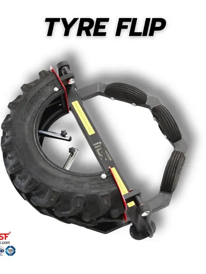 An overhead view of the Tyre Flip machine, showing its octagonal frame and central pivot.