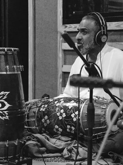 Another powerful black and white shot of a percussionist during rehearsal. The focus is on capturing the soul of the rhythm.