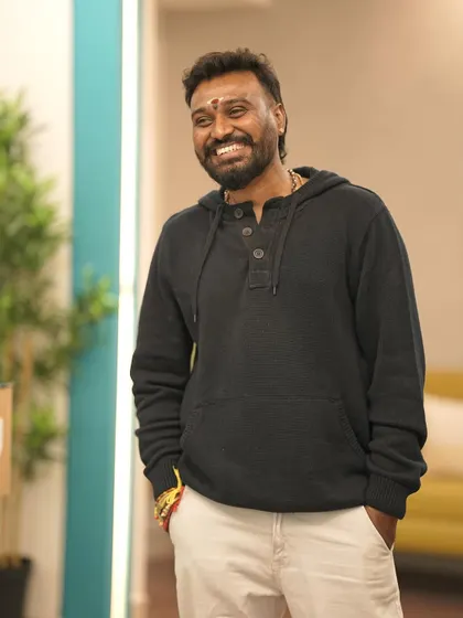 A relaxed and smiling pose. My goal is to create a space where everyone feels comfortable, happy, and free to be themselves.