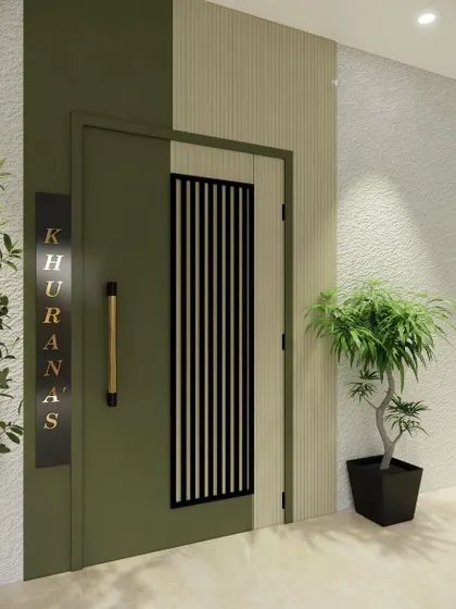 This is another take on a modern entryway, featuring a two-tone design with an olive green door and a beige fluted panel. The vertical grill on the door adds a textural element, while the backlit nameplate provides a touch of luxury.