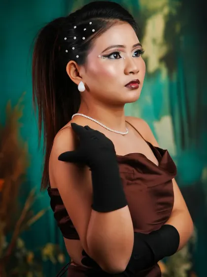 Another shot of the vintage look, showing the elegant pearl necklace and the sophisticated pose.